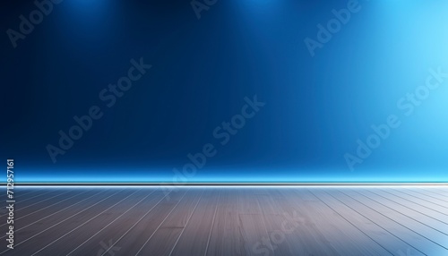 Blue empty wall and wooden floor with interesting light glare.