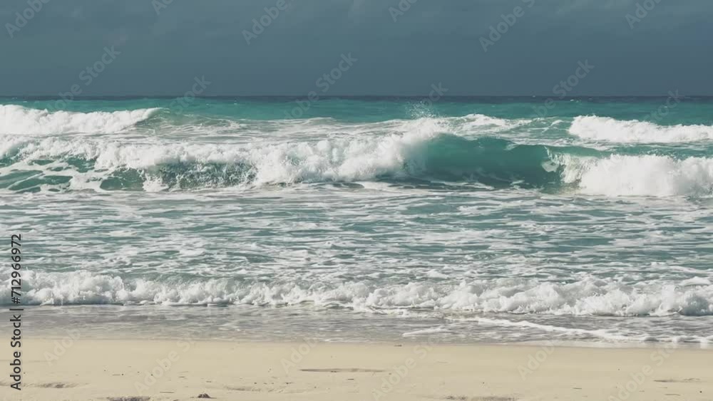 A beautiful Cuban beach in Varadero, Cuba, where you can see the waves and ocean waters on a cloudy day with the sun breaking through the clouds. Turquoise waves. 4K Video A beautiful Cuban beach in Varadero, Cuba, where you can see the waves and ocean waters on a cloudy day with the sun breaking through the clouds. Turquoise waves. 4K Video