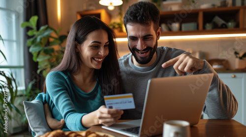 Joyful couple engaged in online shopping