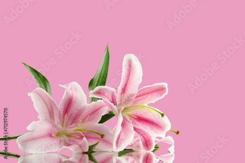 Fototapeta Naklejka Na Ścianę i Meble -  romantic valentine concept Top view photo with lilies on a pink background.