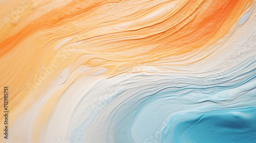 Vivid orange and blue swirls of paint creating an abstract fluid art pattern.