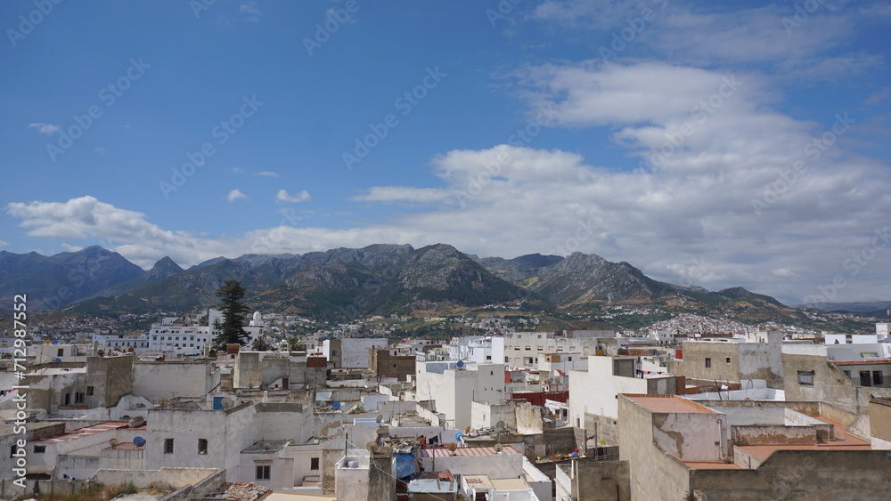 Beautiful town with mountains and blue sky in the background in Morocco