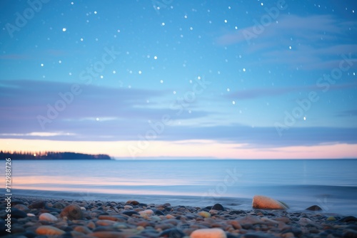 orion constellation over a quiet beach © primopiano