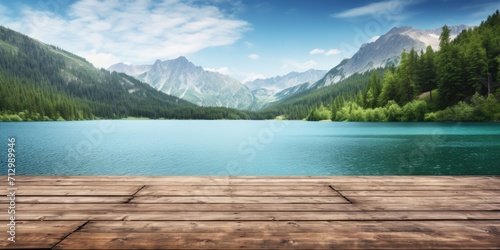 Vibrant image of summer lakes and mountains on an empty wooden table top. © Sona