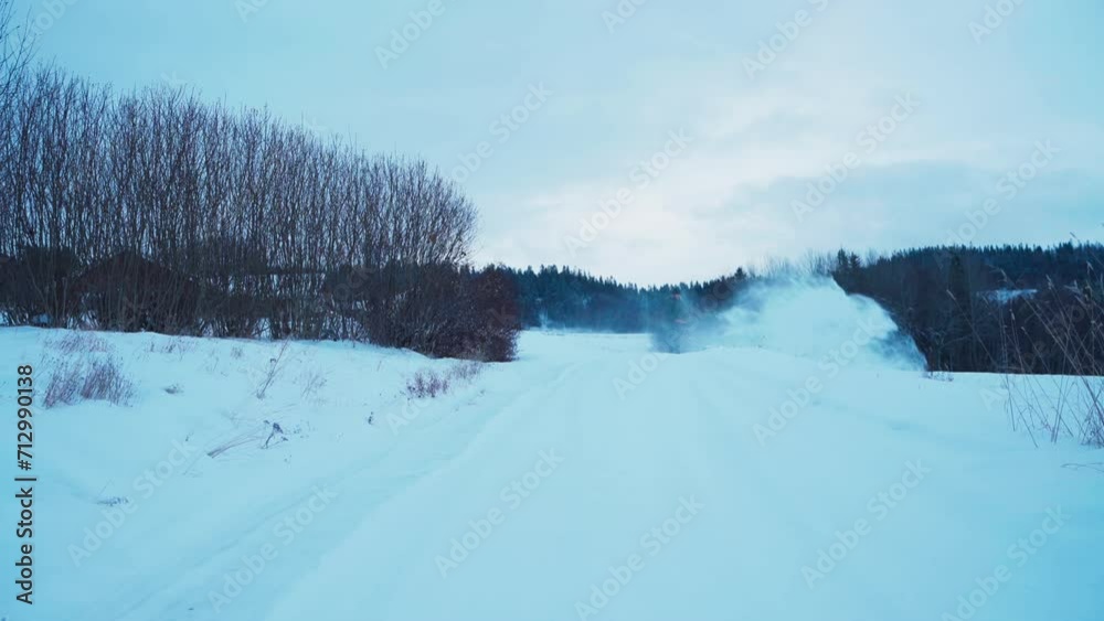 Man Clearing Snow Off The Field With Snow Blower During Winter In Indre Fosen, Norway. wide shot Man Clearing Snow Off The Field With Snow Blower During Winter In Indre Fosen, Norway. wide shot