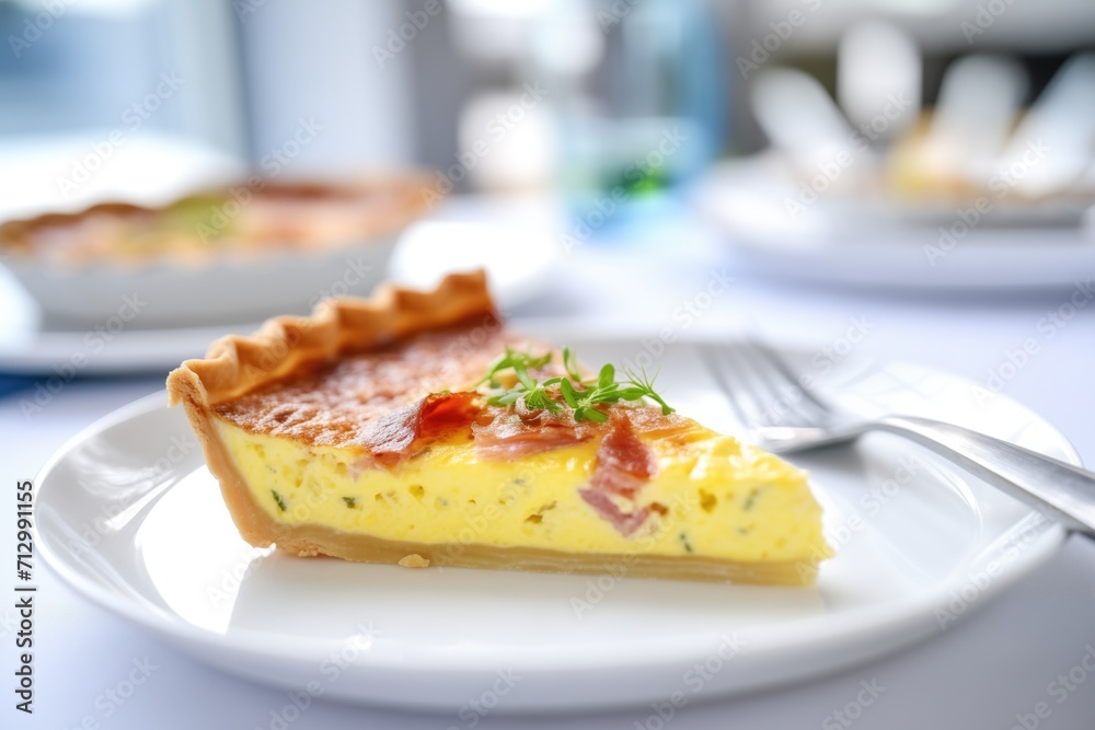 freshly baked quiche lorraine on a white plate with a fork freshly baked quiche lorraine on a white plate with a fork