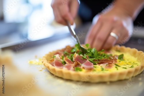 quiche lorraine preparation with egg and bacon mix