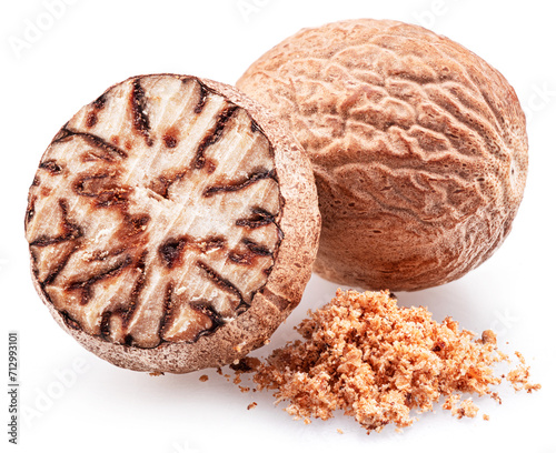 Nutmeg and ground nutmeg heap isolated on white background.