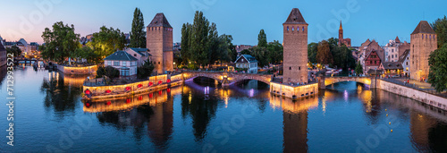 Panoramic view on The Ponts Couverts in evening twilight. Strasbourg with blue cloudy sky. France.