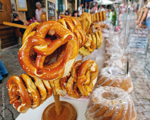 Pretzels and cakes, cupcakes on the Strasbourg streets close-up. French delicious.