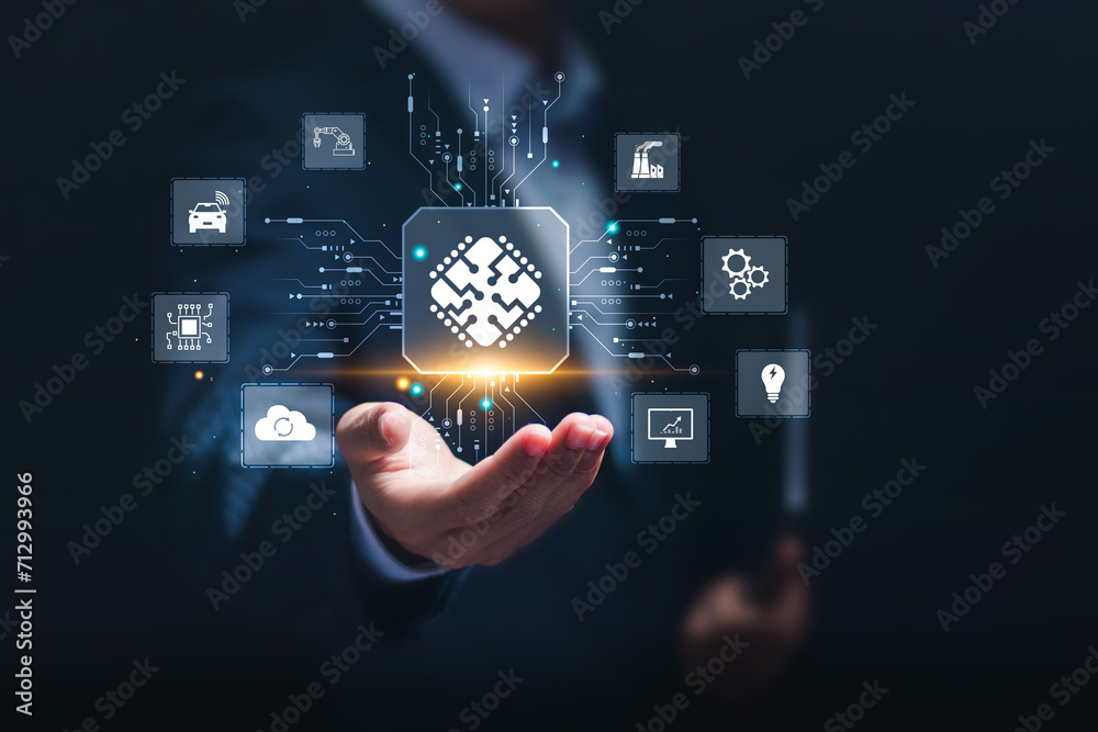 Fototapeta premium Microchip concept, businessman holding virtual screen of microchip icon for artificial intelligence automation and internet of things, IOT, Digital integration. Business internet and technology.