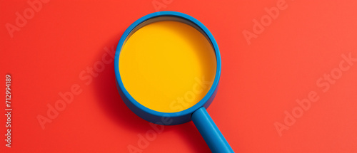 A captivating editorial photograph featuring a colorful magnifying glass. The vibrant hues add an artistic touch to the functional object, making it visually striking and engaging. photo