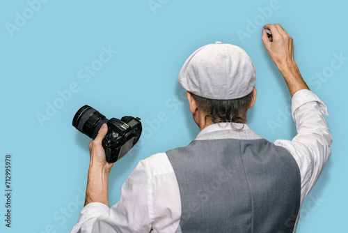 Male teacher explaining how to take good pictures on blue background