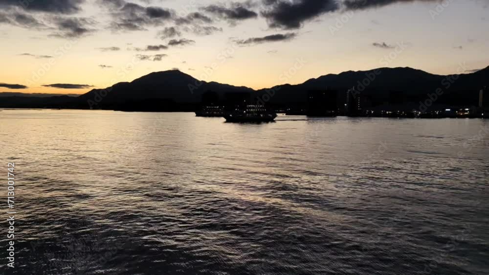 Passenger ferry boats are sailing from Hiroshima mainland to Miyajima island. Passenger ferry boats are sailing from Hiroshima mainland to Miyajima island.