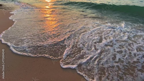 A tranquil view of the beach and sea under the summer sky, capturing the beauty of nature with sandy shores, rolling waves