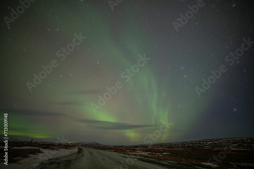 Northern lights in Gullfoss area in winter with ice in Iceland