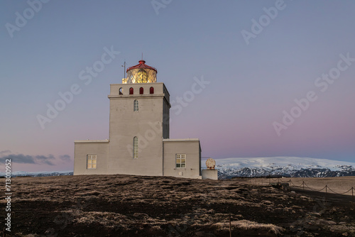 Dyrh  laey viewpoint lighthouse with Katla in background in Iceland
