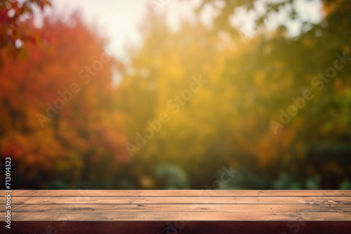 Empty blank wooden table fall background with autumn trees orange yellow color leaves backdrop forest or park nature scene abstract blurred bokeh tabletop for product display desk mockup. Copy space.