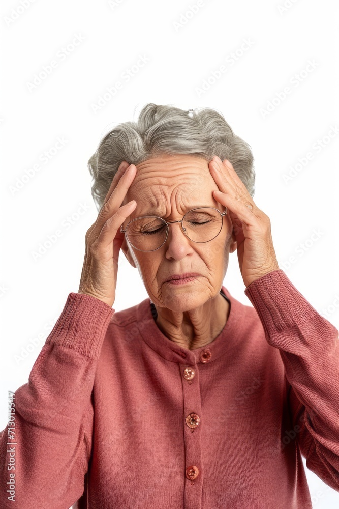 Senior grey-haired woman wearing casual clothes with hand on head, headache because stress. suffering migraine. White background. Senior grey-haired woman wearing casual clothes with hand on head, headache because stress. suffering migraine. White background.