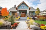 craftsman home with stone accents and a well-kept front garden