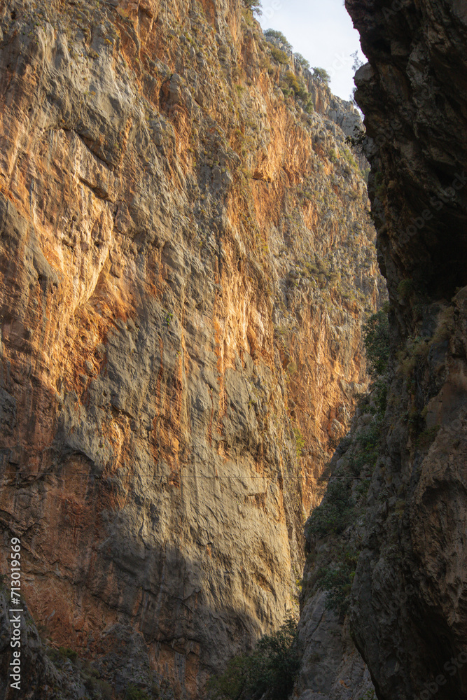 looking up at the mountain side from the deep canyon. In Saklikent Gorge, Turkey