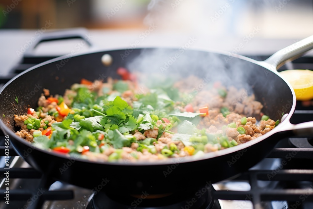 cooking process of chana masala in a skillet