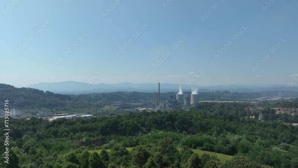 Aerial view of power plant chimneys, industrial area. Close-up of a smoking chimney Aerial view of power plant chimneys, industrial area. Close-up of a smoking chimney