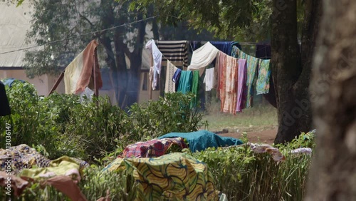 Clothes drying on a rope and on bushes in an African village. Cameroon photo