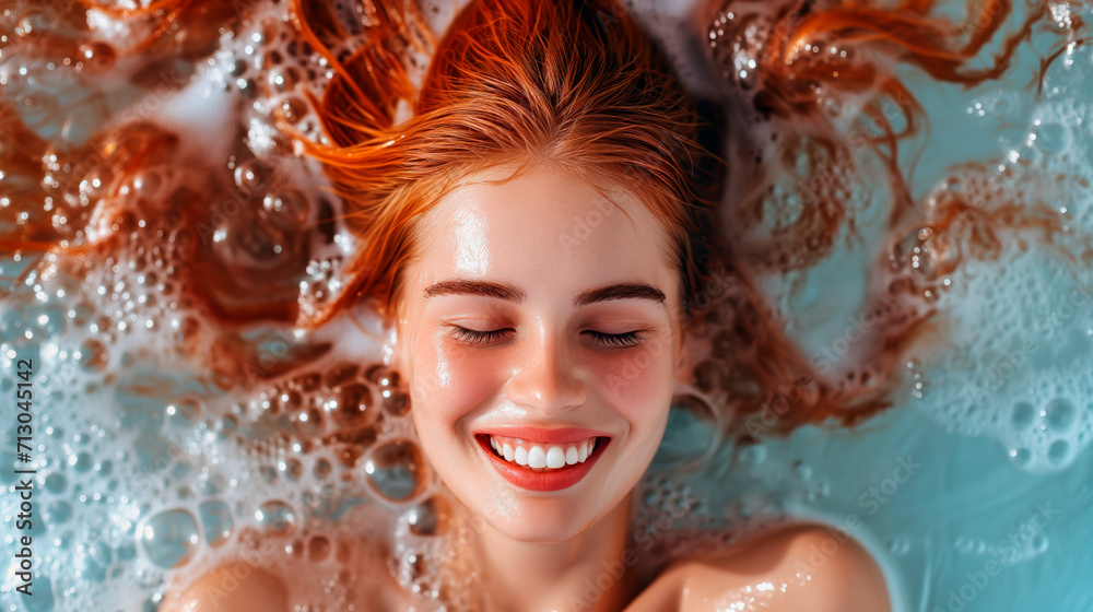 Joyful woman with red hair immersed in bath with soap bubbles. Concept of pampering, wellness and skin care.
Joyful woman with red hair immersed in bath with soap bubbles. Concept of pampering, wellness and skin care.