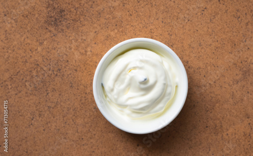 sour cream in a bowl, greek yogurt in a white bowl