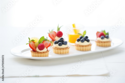 high key shot of elegant fruit tart trio
