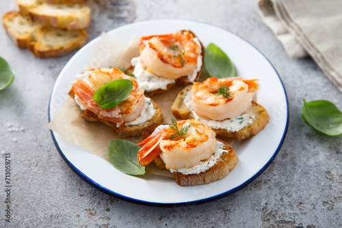 Shrimp crostini with cream cheese and herbs