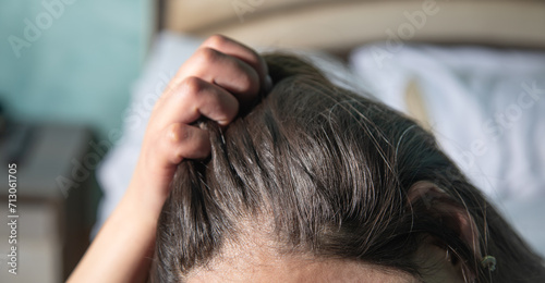 Caucasian woman showing her hair.