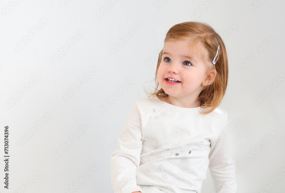 Cute toddler girl looking away isolated on white Cute toddler girl looking away isolated on white
