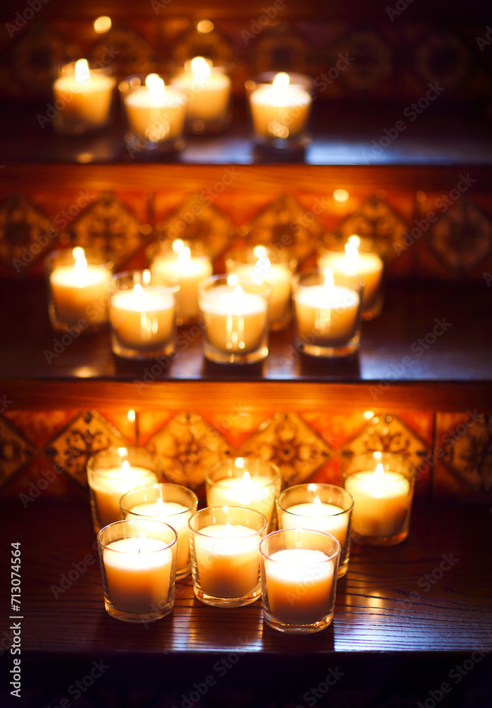 Burning small candles in glasses, romantic decoration in vintage style, selective focus Burning small candles in glasses, romantic decoration in vintage style, selective focus