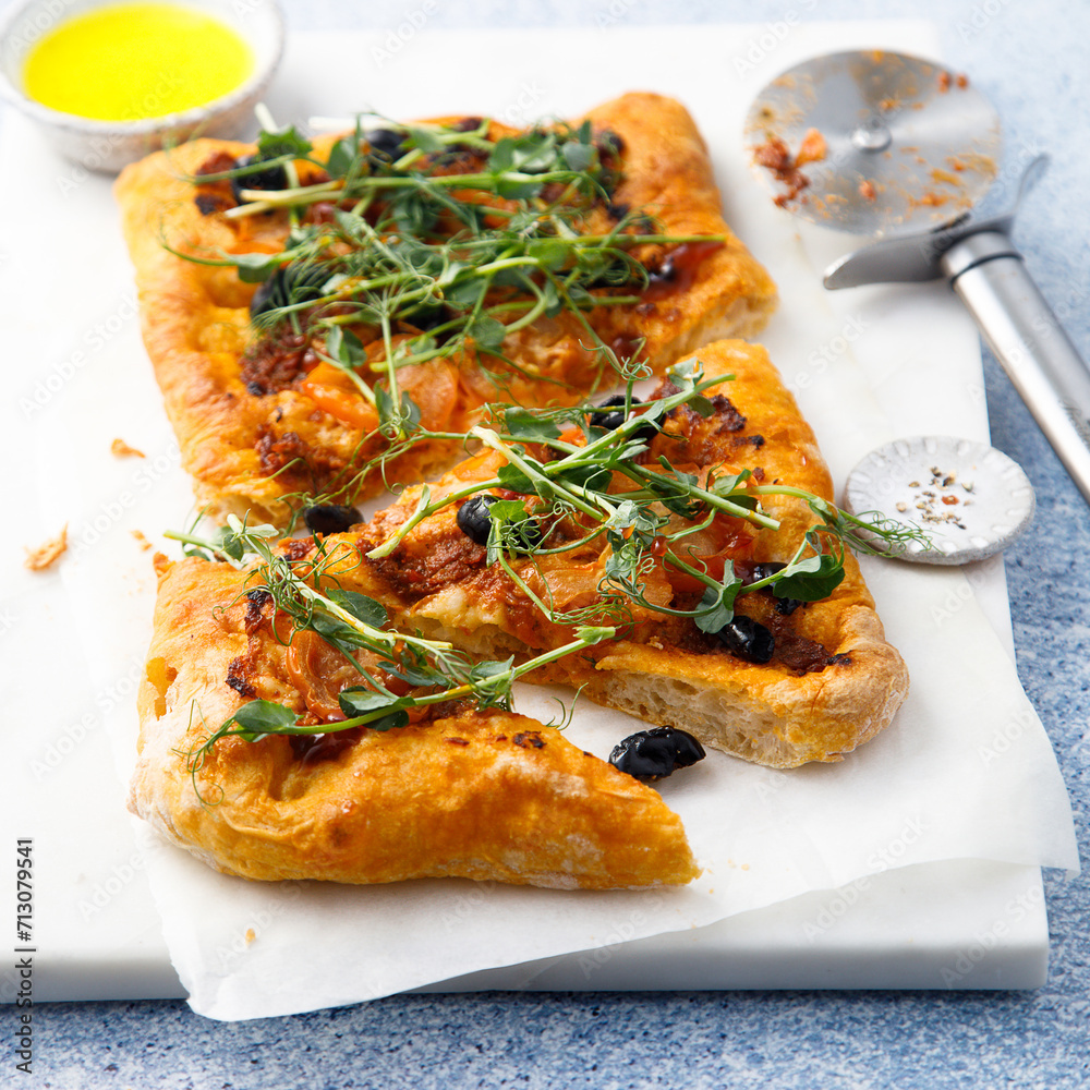 Pizza with olives and sun dried tomatoes Pizza with olives and sun dried tomatoes