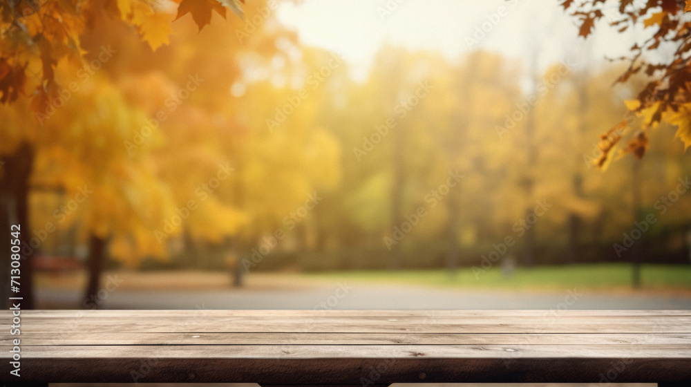 Empty blank wooden table fall background with autumn trees orange yellow color leaves backdrop forest or park nature scene abstract blurred bokeh tabletop for product display desk mockup. Copy space. Empty blank wooden table fall background with autumn trees orange yellow color leaves backdrop forest or park nature scene abstract blurred bokeh tabletop for product display desk mockup. Copy space.