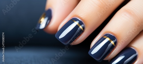 Navy blue nail polish manicure on woman s hand, beauty salon, nail art, french manicure photo