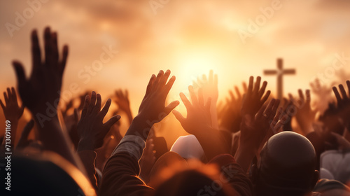 Redemption concept with Christian worshipers raising hands up in the sky in front of cross, Easter miracle concept