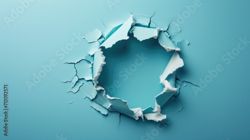 A broken blue wall with pieces falling apart, revealing white space behind, cracked hole in the wall