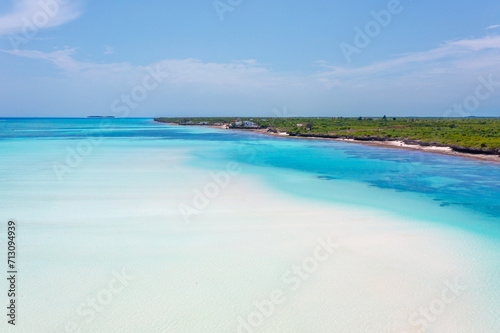 Pristine white tropical beach with blue sea, Zanzibar.