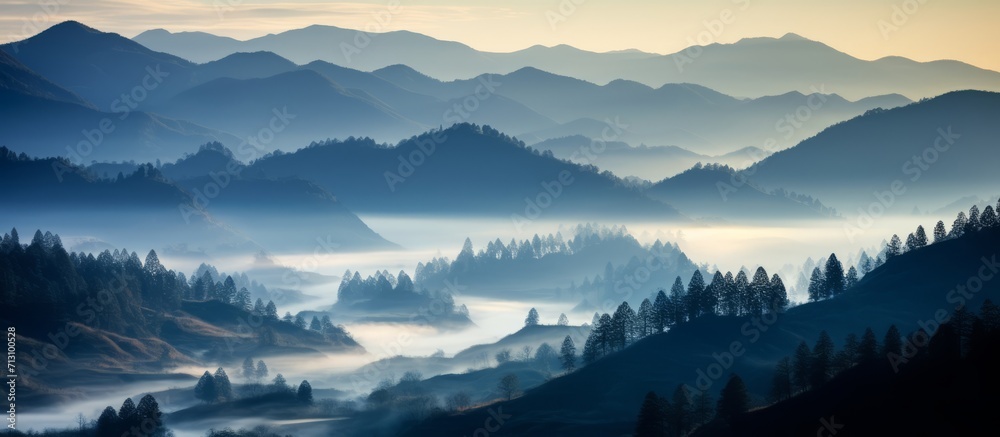 Tranquil Dawn Over Misty Mountain Valleys with Silhouetted Pine Trees Creating a Peaceful and Mystical Landscape