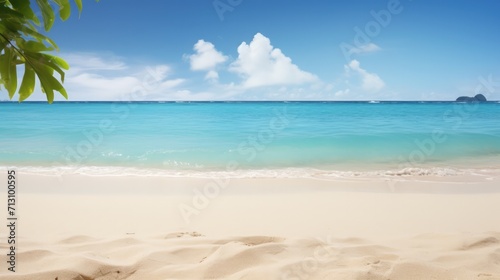A sandy tropical beach with a distant island on the horizon