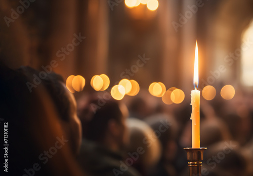 Burning candle on church Easter service photo