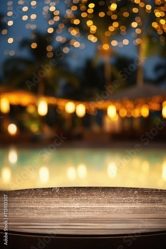 Wooden table pool bokeh background, empty wood desk product display mockup with blurry tropical hotel resort abstract poolside summer travel backdrop advertising presentation. Mock up, copy space.