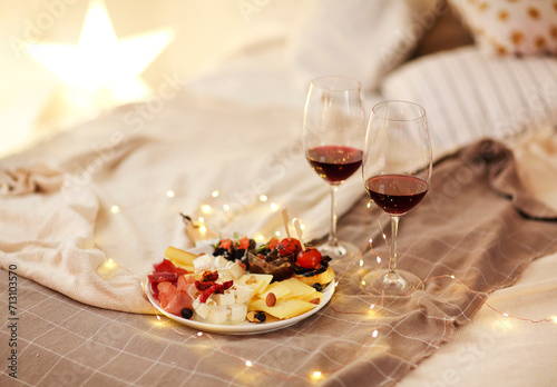 Wine and food on bed