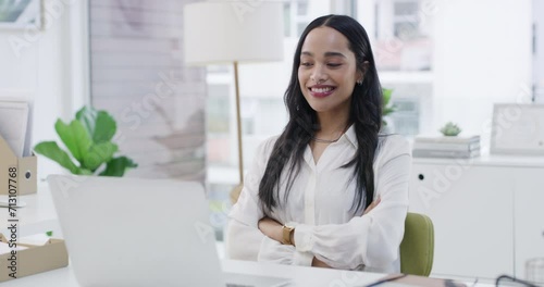 Laptop, success and arms crossed with business woman nodding in office for complete work on report. Computer, smile or happy and confident young employee looking satisfied with finish of project photo