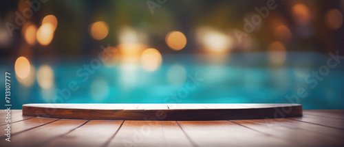 Wooden table pool bokeh background, empty wood desk product display mockup with blurry tropical hotel resort abstract poolside summer travel backdrop advertising presentation. Mock up, copy space.