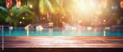 Wooden table pool bokeh background  empty wood desk product display mockup with blurry tropical hotel resort abstract poolside summer travel backdrop advertising presentation. Mock up  copy space.