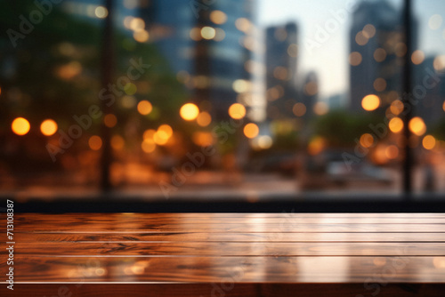 Wooden table bokeh city view background, empty wood desk tabletop counter surface product display mockup with blurry cityscape lights abstract backdrop presentation. Mock up, copy space.